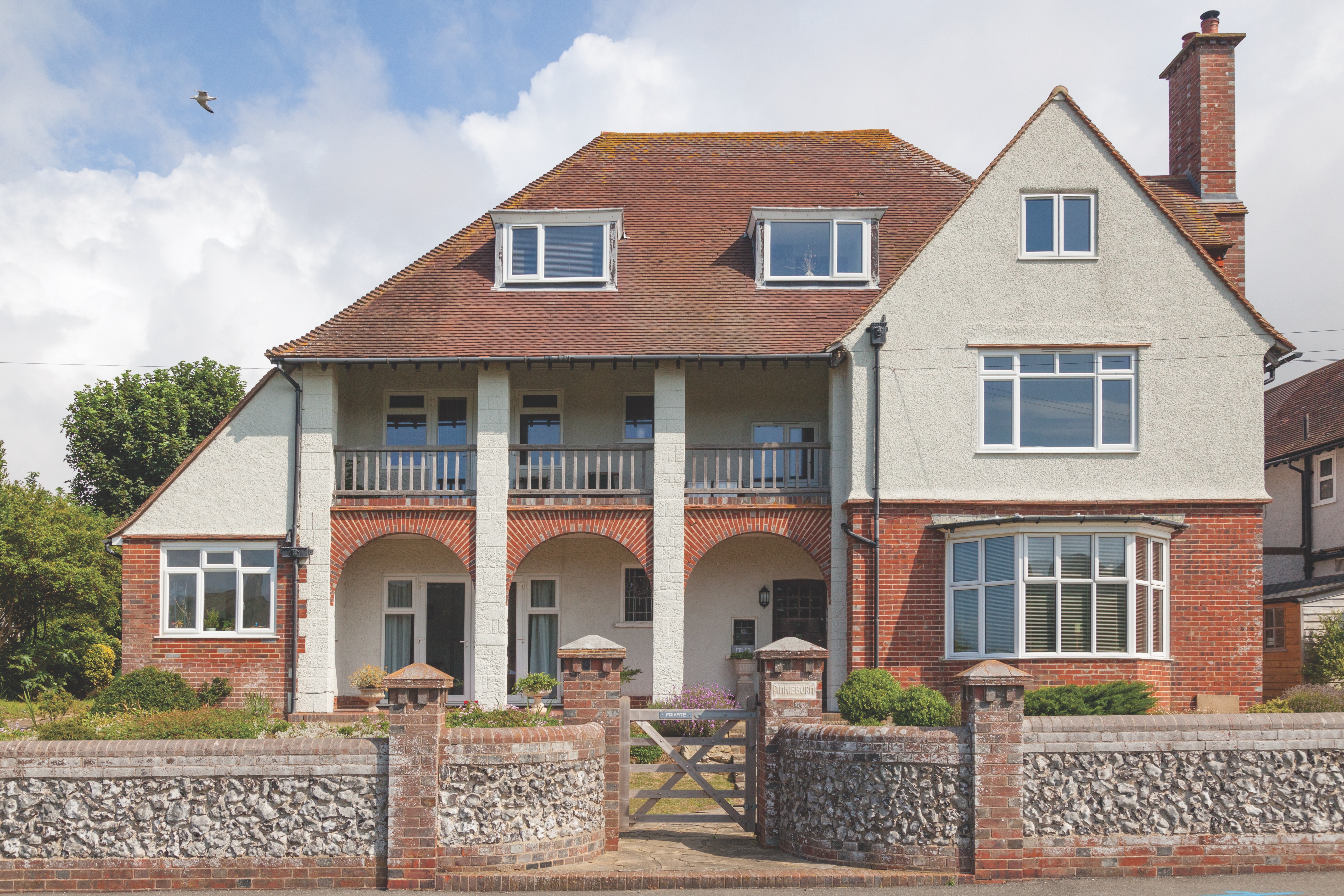 Large traditional UK family home with tiled roof and roofline detailing